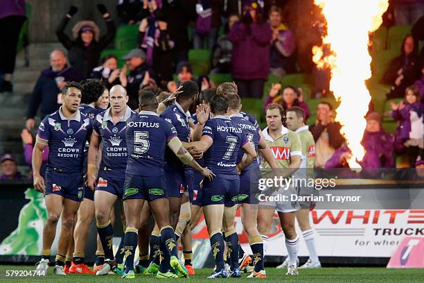 Storm players celebrates a try during the round 20 NRL match between the Melbourne Storm and the Sydney Roosters at AAMI Park on July 23, 2016 in...