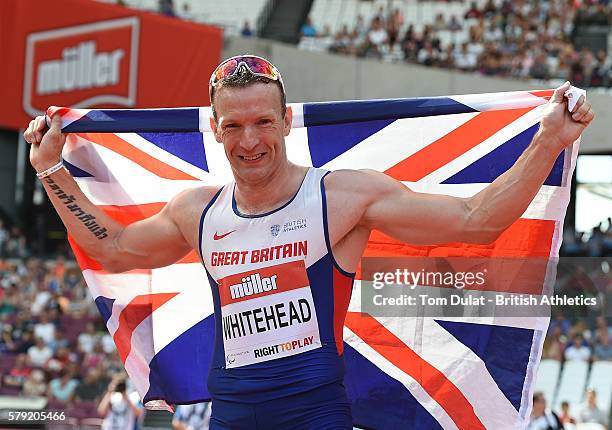 Richard Whitehead of Great Britain celebrates winning the Mens 200m T42 race in a new World Record time during day two of the Muller Anniversary...