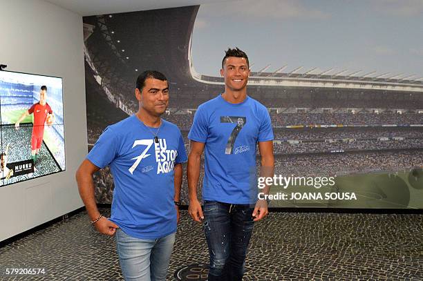 Portugese forward Cristiano Ronaldo and his brother Hugo Aveiro visit the new location of the CR7 museum dedicated Ronaldo's professional career at...