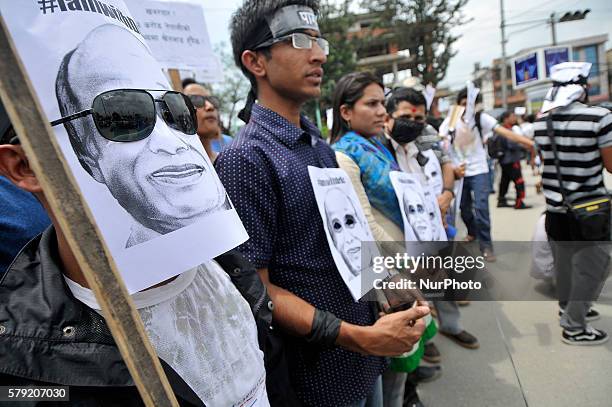 Nepalese poeple hold artistic portrait of Dr. Govinda KC during demonstrate Solidarity to support Prof. Dr. Govinda KC at Kathmandu, Nepal on July...