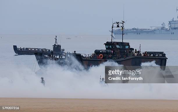 Royal Marines Commandos take part in a simulated beach assault as they entertain crowds during the 28th Sunderland International Air show on July 23,...