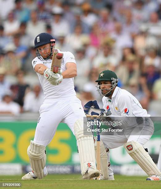 England batsman Jonny Bairstow hits out watched by Sarfraz Ahmed during day two of the 2nd Investec Test match between England and Pakistan at Old...