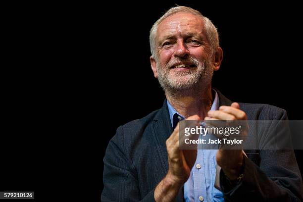Labour Leader Jeremy Corbyn claps during a rally at The Lowry theatre in Salford on July 23, 2016 in Manchester, England. Mr Corbyn, who faces a...