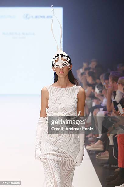 Model walks the runway at the 3D Fashion Presented By Lexus show during Platform Fashion July 2016 at Areal Boehler on July 23, 2016 in Duesseldorf,...