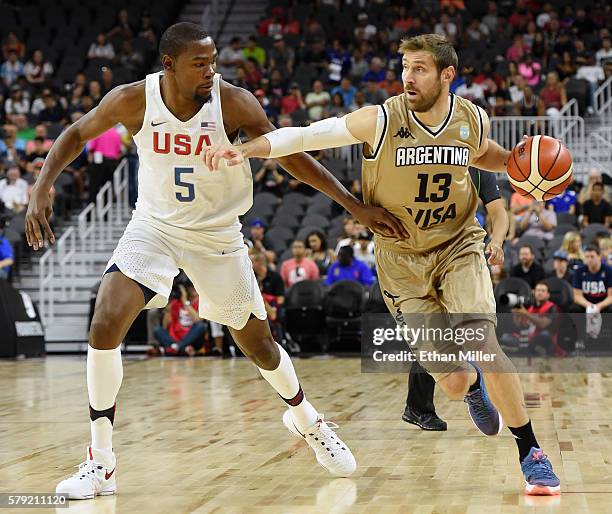 Andres Nocioni of Argentina drives against Kevin Durant of the United States during a USA Basketball showcase exhibition game at T-Mobile Arena on...