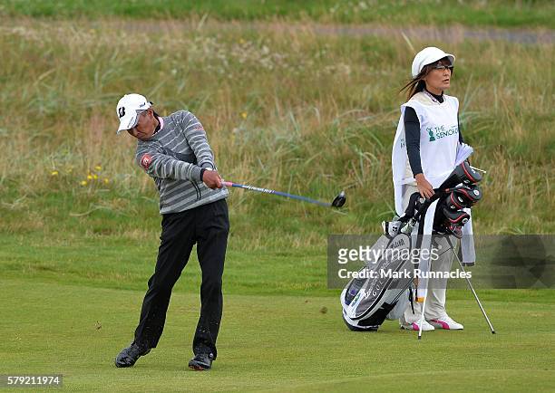 Kohki Idoki of Japan second shot to the 2nd hole during the third day of The Senior Open Championship at Carnoustie Golf Club on July 23, 2016 in...