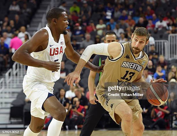 Andres Nocioni of Argentina drives against Kevin Durant of the United States during a USA Basketball showcase exhibition game at T-Mobile Arena on...