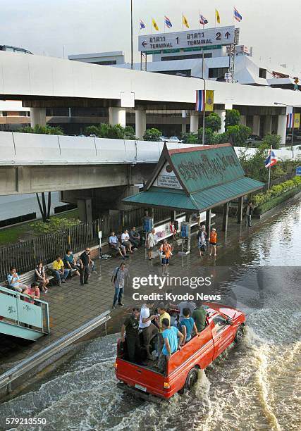 Thailand - Photo shows an inundated road in front of Don Mueang airport in northern Bangkok on Oct. 23, 2011.