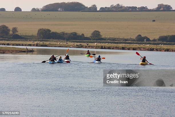 a group of people enjoying rowing boat activity, leisure in day - coxed rowing stock pictures, royalty-free photos & images