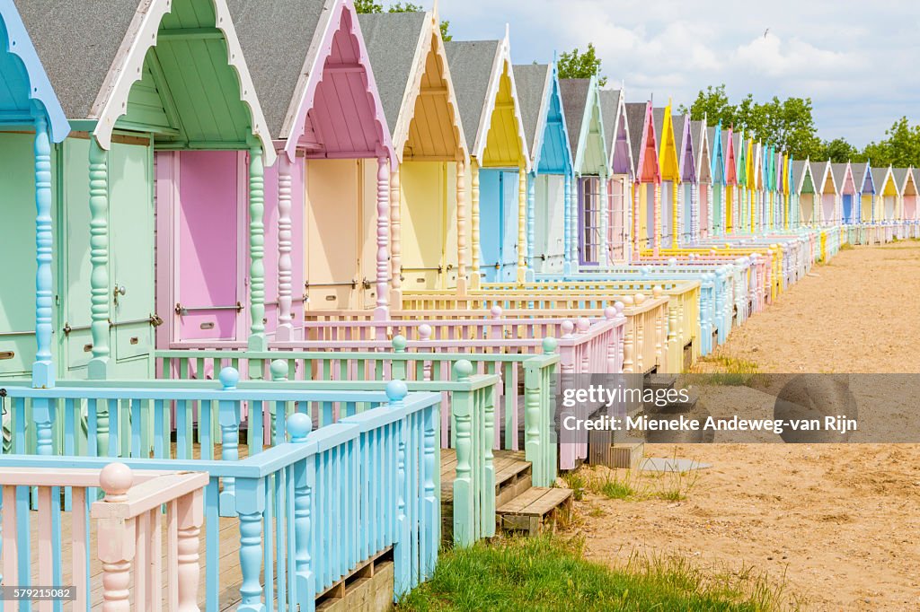 Soft pastel colored beach huts in West Mersea, Mersea Island, Essex, England