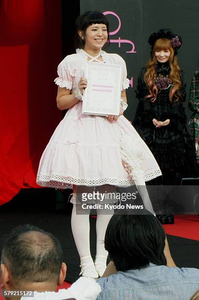 Japan - Yui Hosokawa smiles after winning a ''Lolita fashion'' contest in Shimotsuma, Ibaraki Prefecture, on Oct. 23, 2011. The city northeast of...