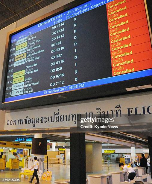 Thailand - The electronic signboard for departures at Don Mueang airport in northern Bangkok show flight cancellations by Thai budget airlines Nok...