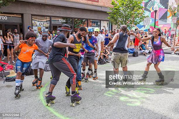 baltimore maryland artscape 2016 -- roller skating club entertains - baltimore maryland daytime stock pictures, royalty-free photos & images
