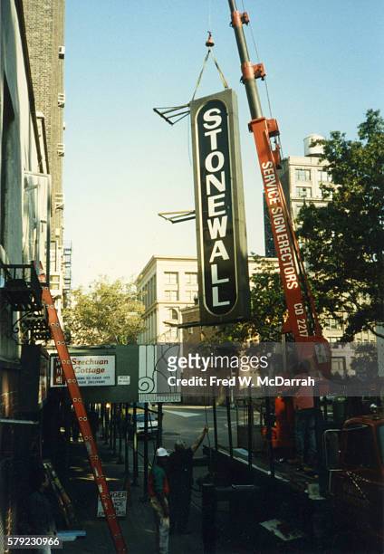 Crane is used to remove the sign from outside the Stonewall Inn, New York, New York, October 11, 1989. The original Stonewall Inn, in the same...