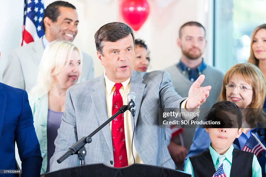 Politician making speech with supporters