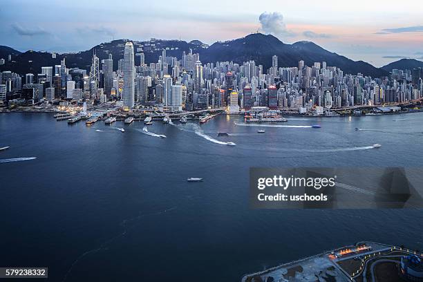 hong kong victoria harbour with cross-harbour tunnel - boat top view stockfoto's en -beelden