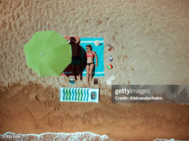 summer vacation essentials - aerial beach people stockfoto's en -beelden