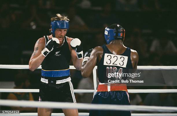 Kevin Barry of New Zealand and Evander Holyfield of the USA competing in the semi-final of the Light Heavyweight boxing event at the Los Angeles...