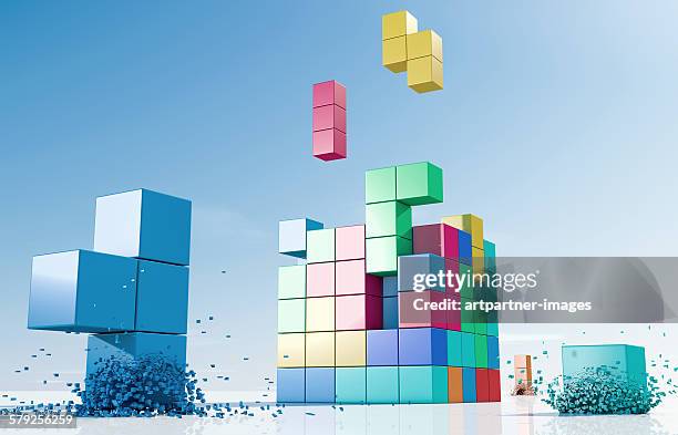 coloured elements forming a cube - blokken stapelen videogame stockfoto's en -beelden