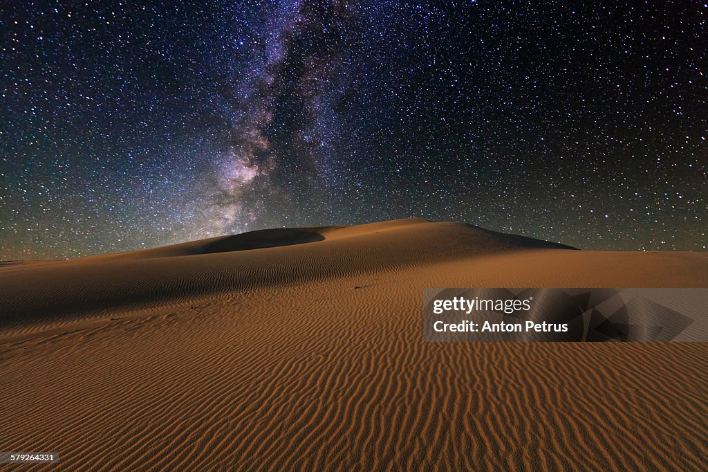 Starry Sky over the sand dunes. Gobi Desert.