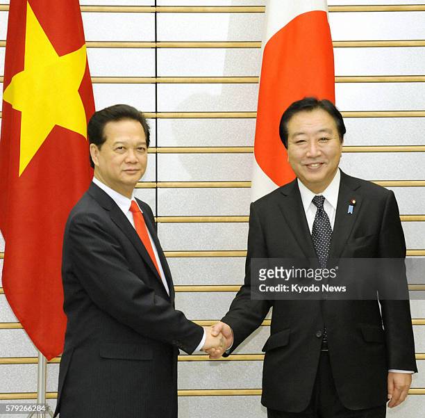 Japan - Japanese Prime Minister Yoshihiko Noda and Vietnamese counterpart Nguyen Tan Dung shake hands at the prime minister's office in Tokyo on Oct....