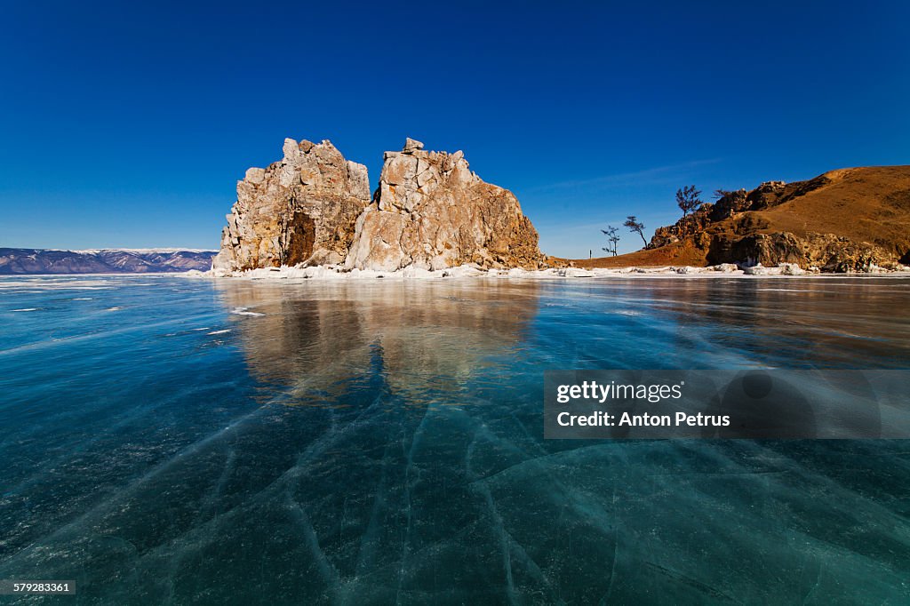 View of the lake and the icy rock. Lake Baikal.