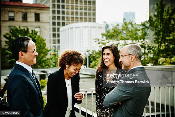 laughing business colleagues in discussion outside - asian friends gathering stock pictures, royalty-free photos & images