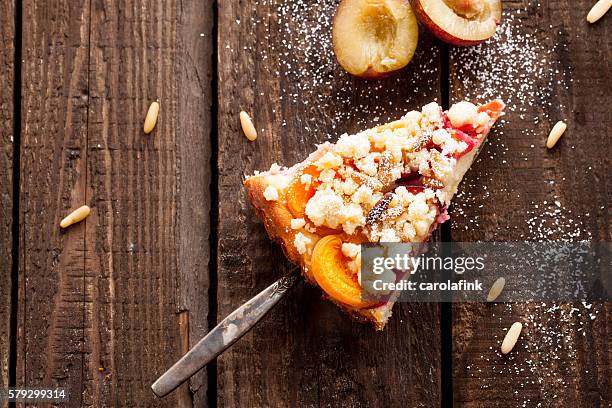 plum cake with pine nuts - kuchen stock pictures, royalty-free photos & images