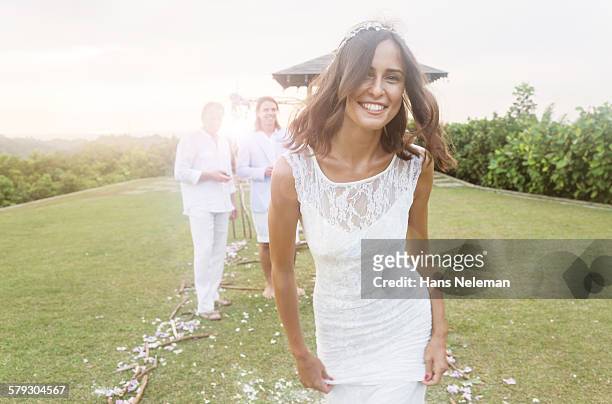 young bride during wedding reception in gardens - bride dress photos et images de collection