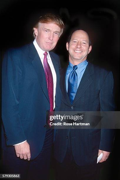Portrait of American real estate developer Donald Trump and magazine publisher Ron Galotti as they attend a party in Trump Tower, New York, New York,...