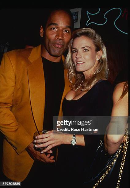 Portrait of American former foorball player OJ Simpson and his wife, Nicole Brown , as they attend a party at the Harley Davidson Cafe, New York, New...