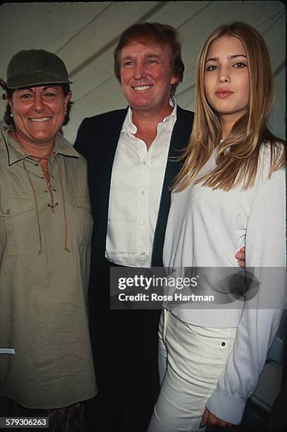 American Council of Fashion Designers of America Executive Director Fern Mallis poses with real estate developer Donald Trump and his daughter,...