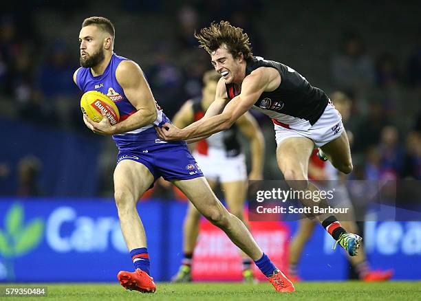 Matt Suckling of the Bulldogs runs with the ball during the round 18 AFL match between the Western Bulldogs and the St Kilda Saints at Etihad Stadium...