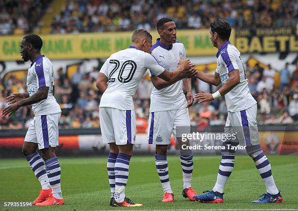 Ayoze Perez of Newcastle celebrates with teammates seen L-R Vurnon Anita, Dwight Gayle and Isaac Hayden after scoring the opening goal during the Pre...