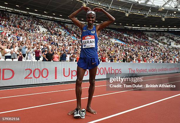 Mo Farah of Great Britain celebrates winning the Mens 5000m on day two of the Muller Anniversary Games at The Stadium - Queen Elizabeth Olympic Park...
