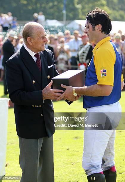 Prince Philip, Duke of Edinburgh and Fred Mannix attend the Royal Salute Coronation Cup at Guards Polo Club on July 23, 2016 in Egham, England.