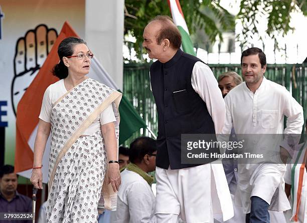 Congress President Sonia Gandhi with UP in-charge Ghulam Nabi Azad and Vice President Rahul Gandhi before flagging off a three-day bus yatra to Uttar...