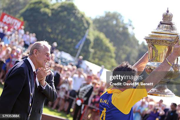 Prince Philip, Duke of Edinburgh and Fred Mannix attend the Royal Salute Coronation Cup at Guards Polo Club on July 23, 2016 in Egham, England.