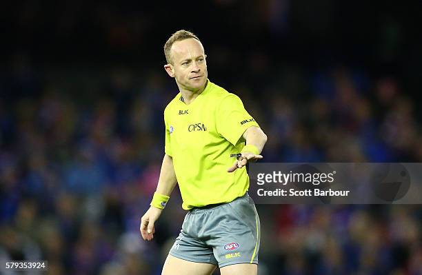 Umpire Ray Chamberlain gestures during the round 18 AFL match between the Western Bulldogs and the St Kilda Saints at Etihad Stadium on July 23, 2016...