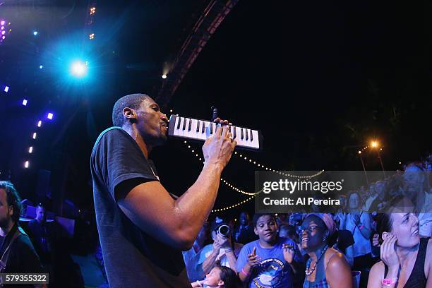 Jon Batiste and Stay Human perform at Celebrate Brooklyn! at Prospect Park Bandshell on July 22, 2016 in New York City.