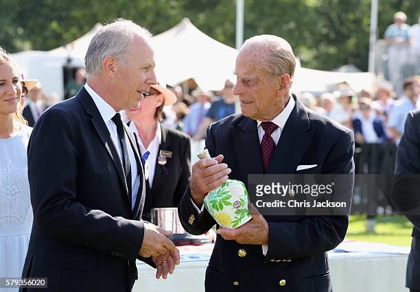 Peter Moore, Global Prestige Brand Director of Royal Salute and Prince Philip, Duke of Edinburgh attend the Royal Salute Coronation Cup at Guards...