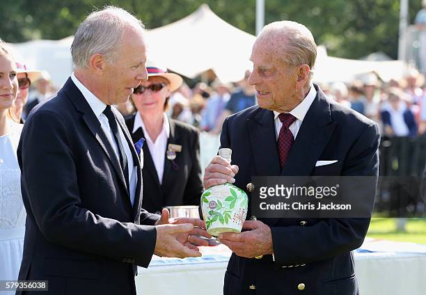 Peter Moore, Global Prestige Brand Director of Royal Salute and Prince Philip, Duke of Edinburgh attend the Royal Salute Coronation Cup at Guards...