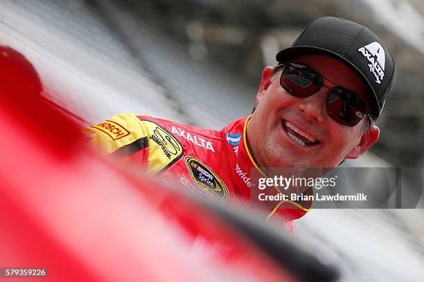 Jeff Gordon, driver of the Axalta Chevrolet, stands on the grid during qualifying for the NASCAR Sprint Cup Series Crown Royal Presents The Combat...