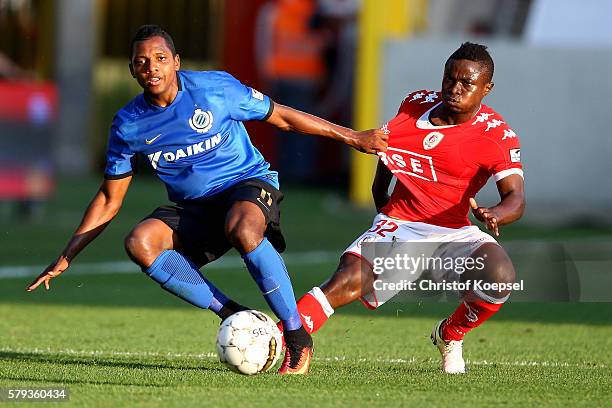 Bernie Ibini-Isei of Brugge challenges Collins Fai of Standard Liege during the Supercup match between Club Brugge and Standrad Liege at...