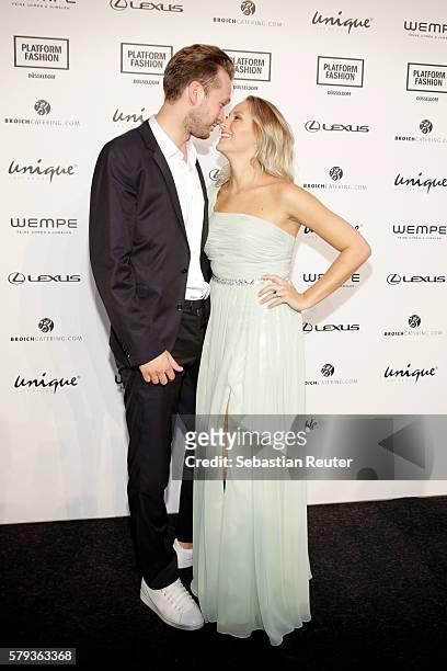 Marvin Albrecht and Anna Hofbauer attend the Unique show during Platform Fashion July 2016 at Areal Boehler on July 23, 2016 in Duesseldorf, Germany.