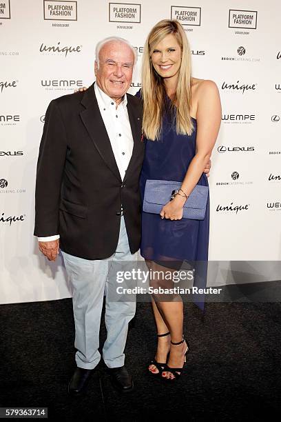Verena Wriedt and her father attend the Unique show during Platform Fashion July 2016 at Areal Boehler on July 23, 2016 in Duesseldorf, Germany.