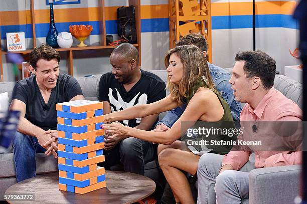 Goran Visnjic, Malcolm Barrett and Matt Lanter of NBC's "Timeless" play "Fan-Jenga" with Fandango hosts Nikki Novak and Kristian Harloff at the...