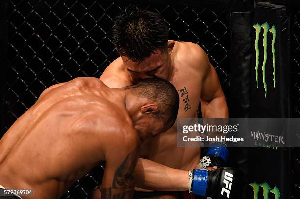 Alex Oliveira of Brazil pressures James Moontasri in their welterweight bout during the UFC Fight Night event at the United Center on July 23, 2016...