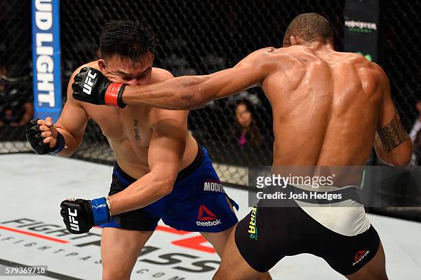 Alex Oliveira of Brazil punches James Moontasri in their welterweight bout during the UFC Fight Night event at the United Center on July 23, 2016 in...