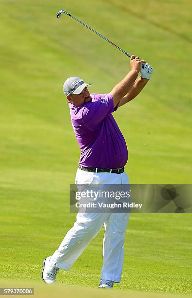 Brendon de Jonge of Zimbabwe takes his second shot on the 16th fairway during the third round of the RBC Canadian Open at Glen Abbey Golf Club on...